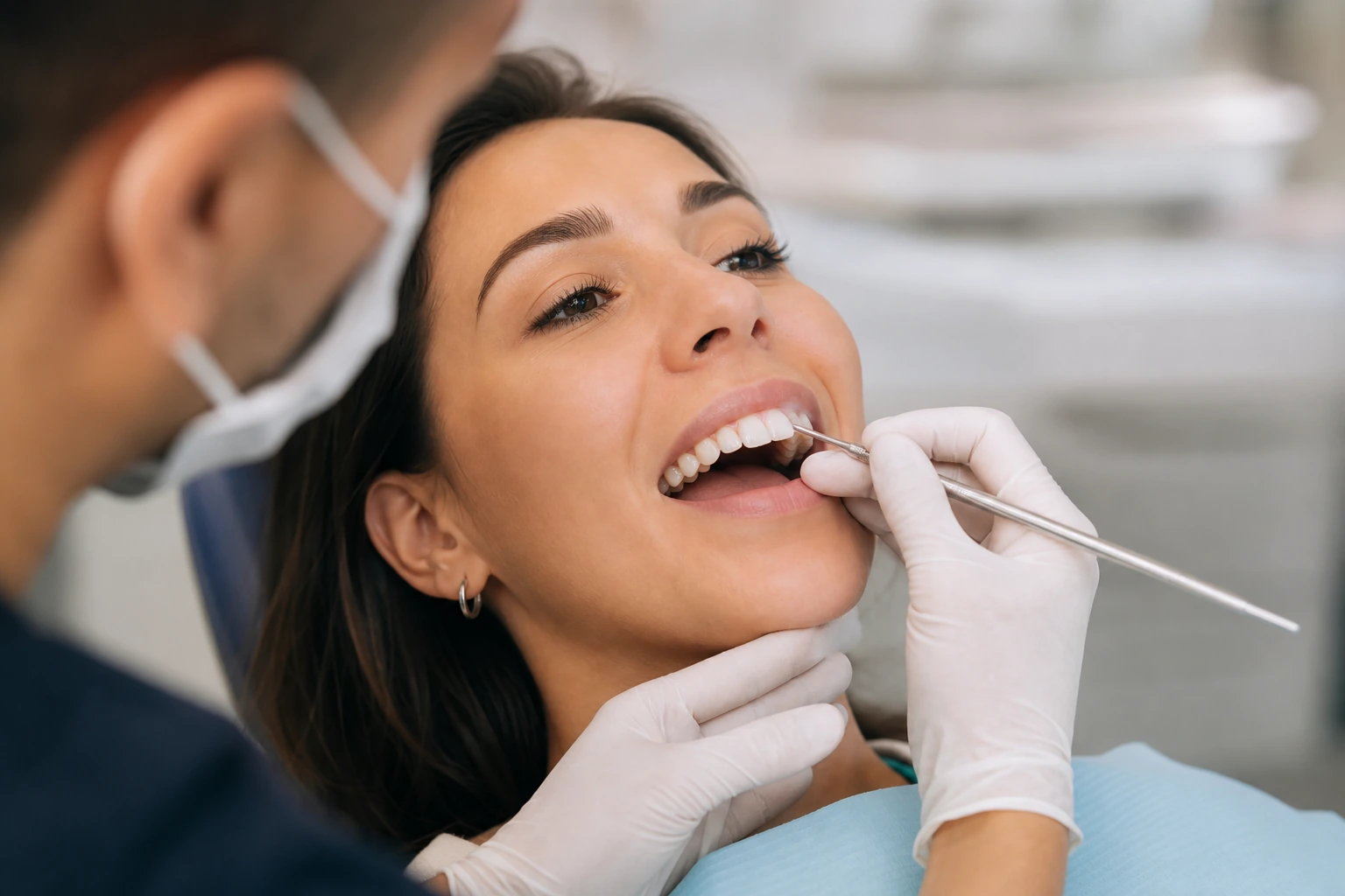 Dentist applying composite bonding to front tooth