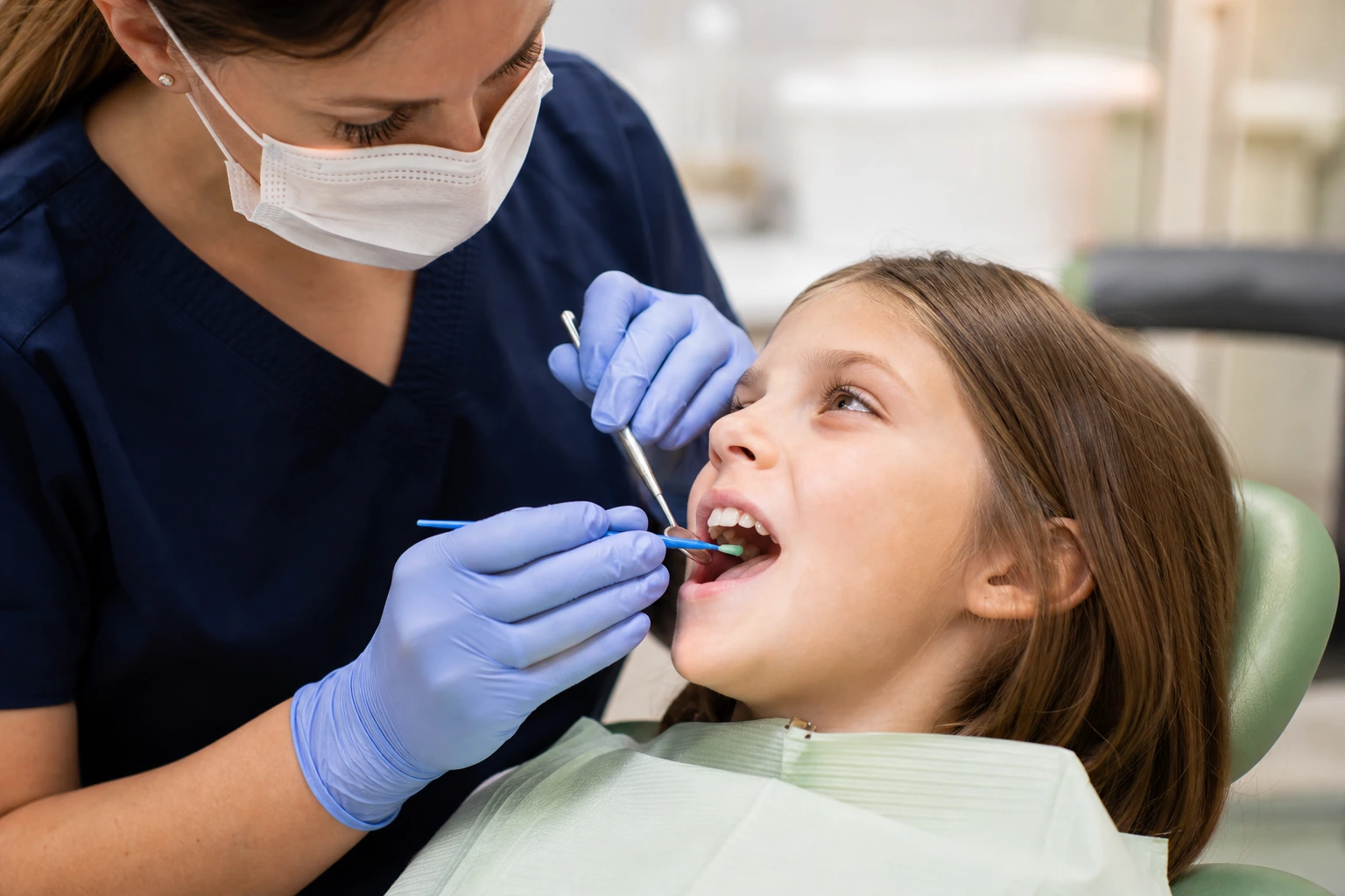 Dentist applying dental sealant to protect teeth from decay