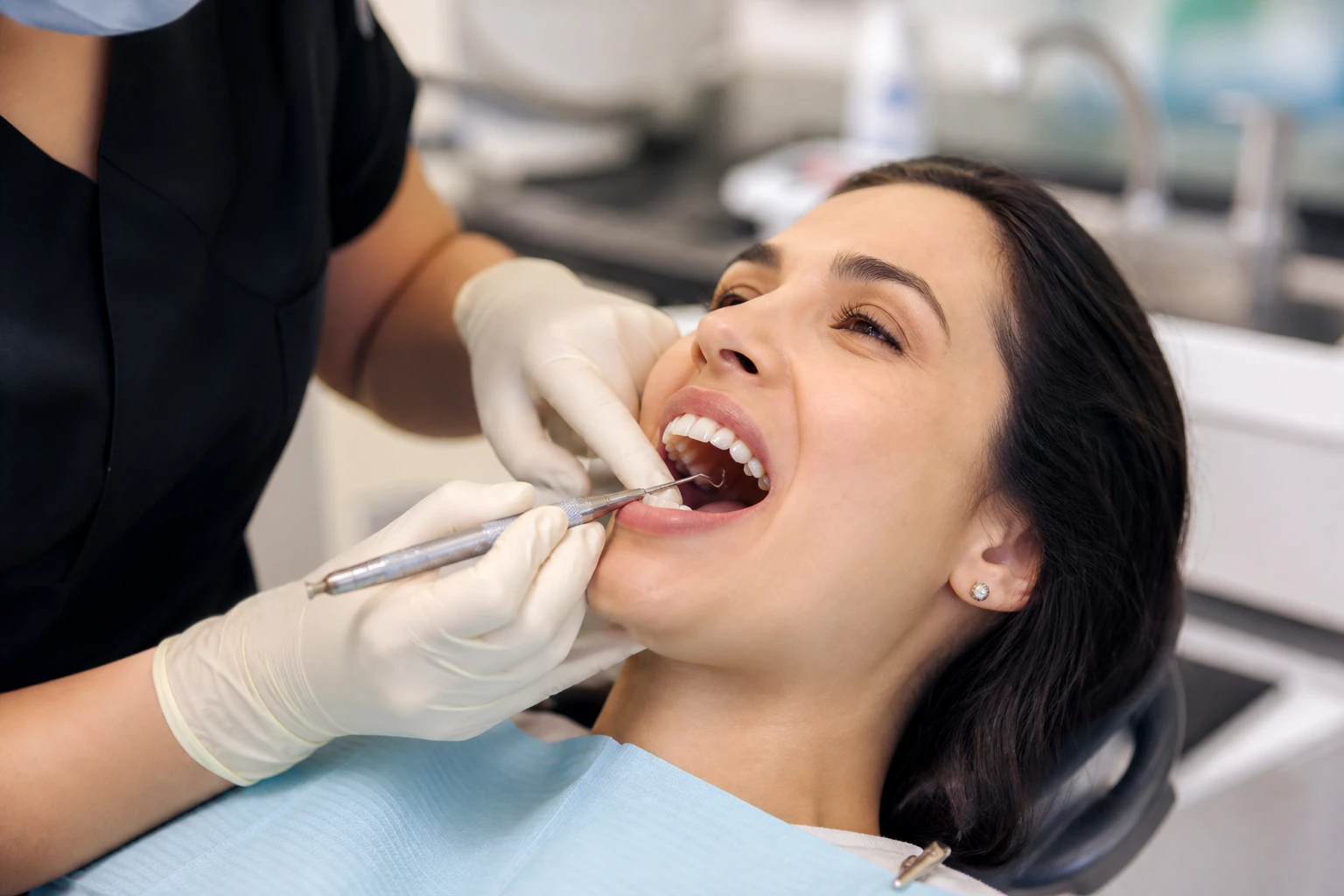 Dental hygienist performing scaling and root planing
